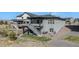 Stunning two-story home with a well-manicured yard and a spacious elevated deck at 328 Simmental Loop, Castle Rock, CO 80104
