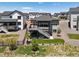 Back exterior of a two story home with patio, deck and fenced yard at 328 Simmental Loop, Castle Rock, CO 80104