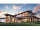 Stunning modern home with large windows, stone accents, and beautiful landscaping at 328 Simmental Loop, Castle Rock, CO 80104