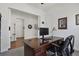 Well-lit home office featuring a classic wooden desk, comfortable chair, and ample space for work at 328 Simmental Loop, Castle Rock, CO 80104