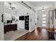 Inviting home office featuring a large desk, a sliding barn door, and bright natural light at 328 Simmental Loop, Castle Rock, CO 80104