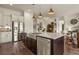 Well-lit kitchen features an island with granite countertops and stainless-steel appliances at 328 Simmental Loop, Castle Rock, CO 80104