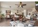 Open concept living space with a leather couch, dining area, and modern kitchen at 328 Simmental Loop, Castle Rock, CO 80104
