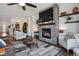 Inviting living room with stone fireplace, mounted television, and modern furnishings at 328 Simmental Loop, Castle Rock, CO 80104