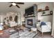 Inviting living room with a stone fireplace, comfortable seating, and stylish decor for a cozy atmosphere at 328 Simmental Loop, Castle Rock, CO 80104