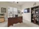 Functional office space with a large desk, wall-mounted TV, and ample storage at 328 Simmental Loop, Castle Rock, CO 80104