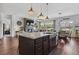 Open concept kitchen featuring a large island with views of the living and dining areas at 328 Simmental Loop, Castle Rock, CO 80104