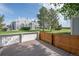 Apartment community back porch view offers well-manicured lawns with mature evergreens and building views at 5190 Buckingham Rd, Boulder, CO 80301