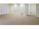 Finished basement with neutral carpet, two closets, and room for an entertainment or play area at 5190 Buckingham Rd, Boulder, CO 80301