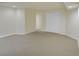 Unfinished basement with neutral carpet, white walls, and a large closet at 5190 Buckingham Rd, Boulder, CO 80301