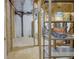 Unfinished basement with painted walls and ceiling, and shelving units for storage at 5190 Buckingham Rd, Boulder, CO 80301