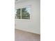 This bright bedroom is carpeted and features a large window at 5190 Buckingham Rd, Boulder, CO 80301