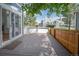 Relax on this spacious outdoor wooden deck, surrounded by mature trees and partial fencing for privacy at 5190 Buckingham Rd, Boulder, CO 80301