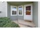 Inviting front entrance with a storm door and convenient porch area at 5190 Buckingham Rd, Boulder, CO 80301