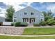 Charming townhome featuring a well-maintained lawn and a welcoming front entrance with red door at 5190 Buckingham Rd, Boulder, CO 80301