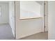 Bright hallway with white walls, neutral carpet, and two doors leading to other rooms at 5190 Buckingham Rd, Boulder, CO 80301