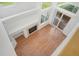 Sun-drenched living room with hardwood flooring, cozy fireplace, and sliding glass doors to outside patio at 5190 Buckingham Rd, Boulder, CO 80301