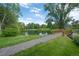 Picturesque pond with walking path, bridge, and lush green landscaping in a tranquil setting at 5190 Buckingham Rd, Boulder, CO 80301