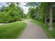 Picturesque walking path winding through lush greenery, showcasing the community's scenic outdoor spaces at 5190 Buckingham Rd, Boulder, CO 80301