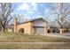 Ranch style home with attached garage and mature landscaping at 20 Birdie Ln, Littleton, CO 80123