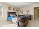 Well-lit bedroom with a double bed, dresser and adjacent bathroom at 6623 Esmeralda Dr, Castle Rock, CO 80108