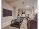 Finished basement living area with modern decor and mounted television at 3540 E 5Th Ave, Denver, CO 80206