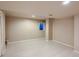 Unfinished basement space with light wood flooring and small window at 3540 E 5Th Ave, Denver, CO 80206