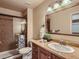 Well-lit bathroom featuring glass shower and vanity at 3540 E 5Th Ave, Denver, CO 80206