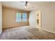 Carpeted bedroom with window, ceiling fan, and closet at 3540 E 5Th Ave, Denver, CO 80206