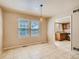 Bright dining area with tile flooring and a view into the kitchen through an open doorway at 3540 E 5Th Ave, Denver, CO 80206