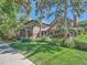 Spacious home with lush green lawn, mature trees, and manicured landscaping at 3540 E 5Th Ave, Denver, CO 80206