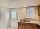Cozy kitchen featuring granite countertops and exterior door access at 3540 E 5Th Ave, Denver, CO 80206