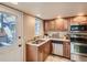 Well-lit kitchen features stainless steel appliances and granite countertops at 3540 E 5Th Ave, Denver, CO 80206