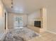 Inviting living room with a brick fireplace, tiled floors, and a large, plush rug at 3540 E 5Th Ave, Denver, CO 80206