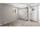 Simple bedroom with carpeting, a closet with patterned curtain, and a window at 2213 E Panama Dr, Centennial, CO 80121