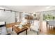 Open-concept area features hardwood floors, bar seating, stairs and a cozy living space at 2213 E Panama Dr, Centennial, CO 80121