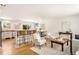 Inviting living room with hardwood floors, a breakfast bar, and elegant, neutral-toned furniture at 2213 E Panama Dr, Centennial, CO 80121