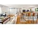 Inviting living space connects to a kitchen with counter seating and a sliding barn door at 2213 E Panama Dr, Centennial, CO 80121