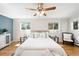 Serene main bedroom with wood flooring, soft lighting, and neutral decor at 2213 E Panama Dr, Centennial, CO 80121