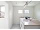 Bright bathroom featuring double sinks with light countertops, large mirror and neutral walls at 129 Mesa Way, Superior, CO 80027
