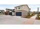 Modern townhome with two-car garage, landscaping and hardscaped parking area at 129 Mesa Way, Superior, CO 80027