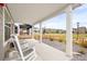 Relax on the front porch with white columns and rocking chairs, overlooking the charming neighborhood at 129 Mesa Way, Superior, CO 80027