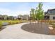 Scenic view of a community park with walking paths, trees, and well-maintained landscaping at 129 Mesa Way, Superior, CO 80027