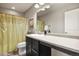 Bathroom with a neutral color palette, sink, vanity, and framed mirror at 1273 S Dallas Ct, Denver, CO 80247