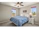 Bedroom with a queen bed, ceiling fan, and a bright window view at 1273 S Dallas Ct, Denver, CO 80247