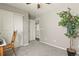 Bedroom with neutral walls, closet, carpet, and view to additional rooms at 1273 S Dallas Ct, Denver, CO 80247