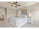 Bedroom with a queen-sized bed, ceiling fan, and matching nightstands at 1273 S Dallas Ct, Denver, CO 80247