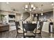 Open-concept kitchen flows into dining area and living room with fireplace at 1273 S Dallas Ct, Denver, CO 80247