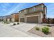 Exterior view of townhomes with attached garages and well-kept landscaping at 1273 S Dallas Ct, Denver, CO 80247