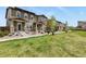 Attractive townhouse exteriors with well-manicured lawns and landscaping in a row of homes at 1273 S Dallas Ct, Denver, CO 80247